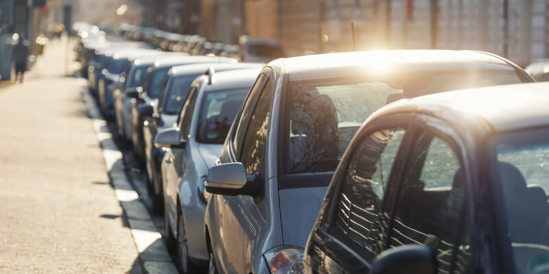 A row of parked cars along a street