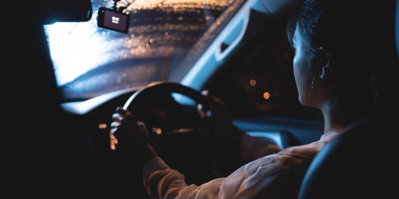 Girl driving in the dark