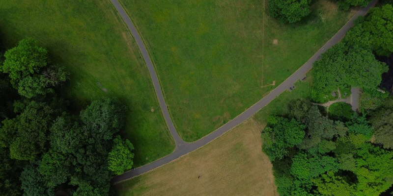 Aerial view of a T-Junction with trees and fields around