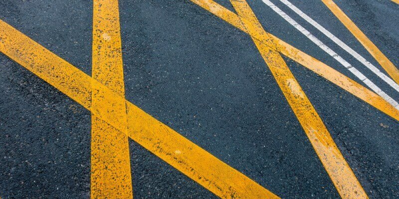 Yellow hatched box painted onto the road