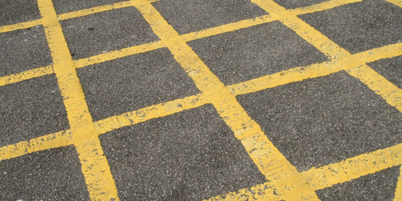 Yellow hatched area painted onto ground