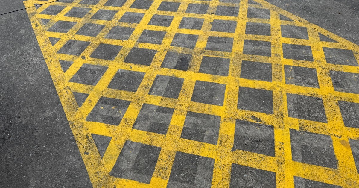 Yellow crossed box painted onto road